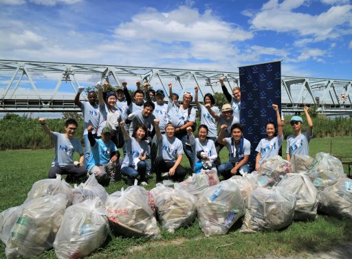 Point72 employees volunteering at river clean up event in Tokyo