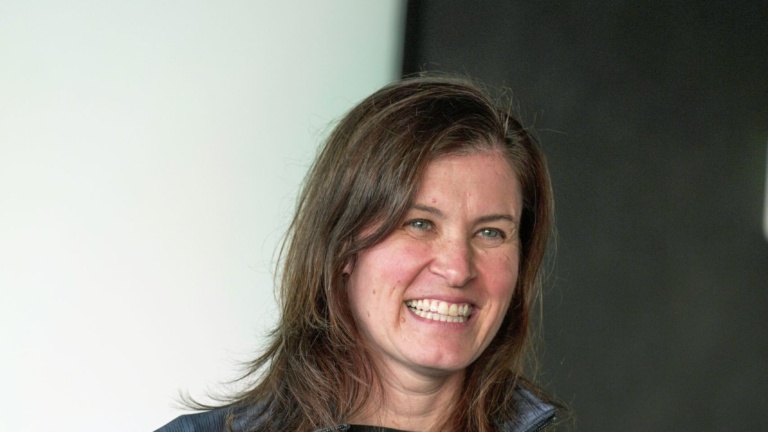 Academy director in front of classroom