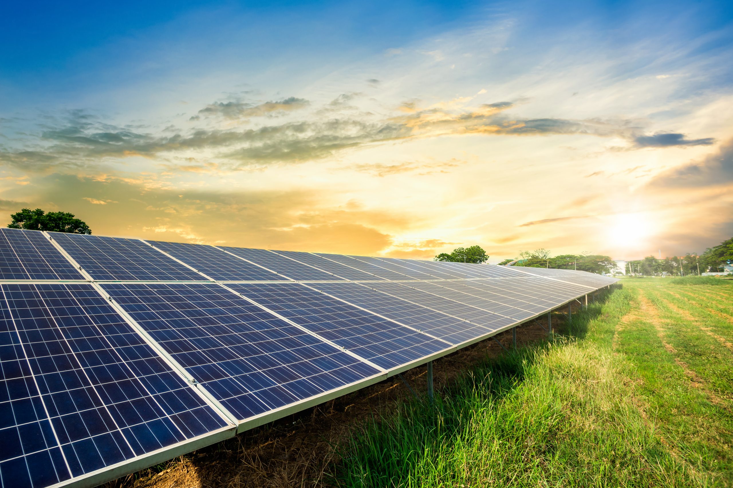 Solar panel with sunset in the background