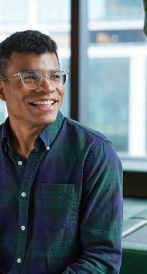 Male employee smiling in office