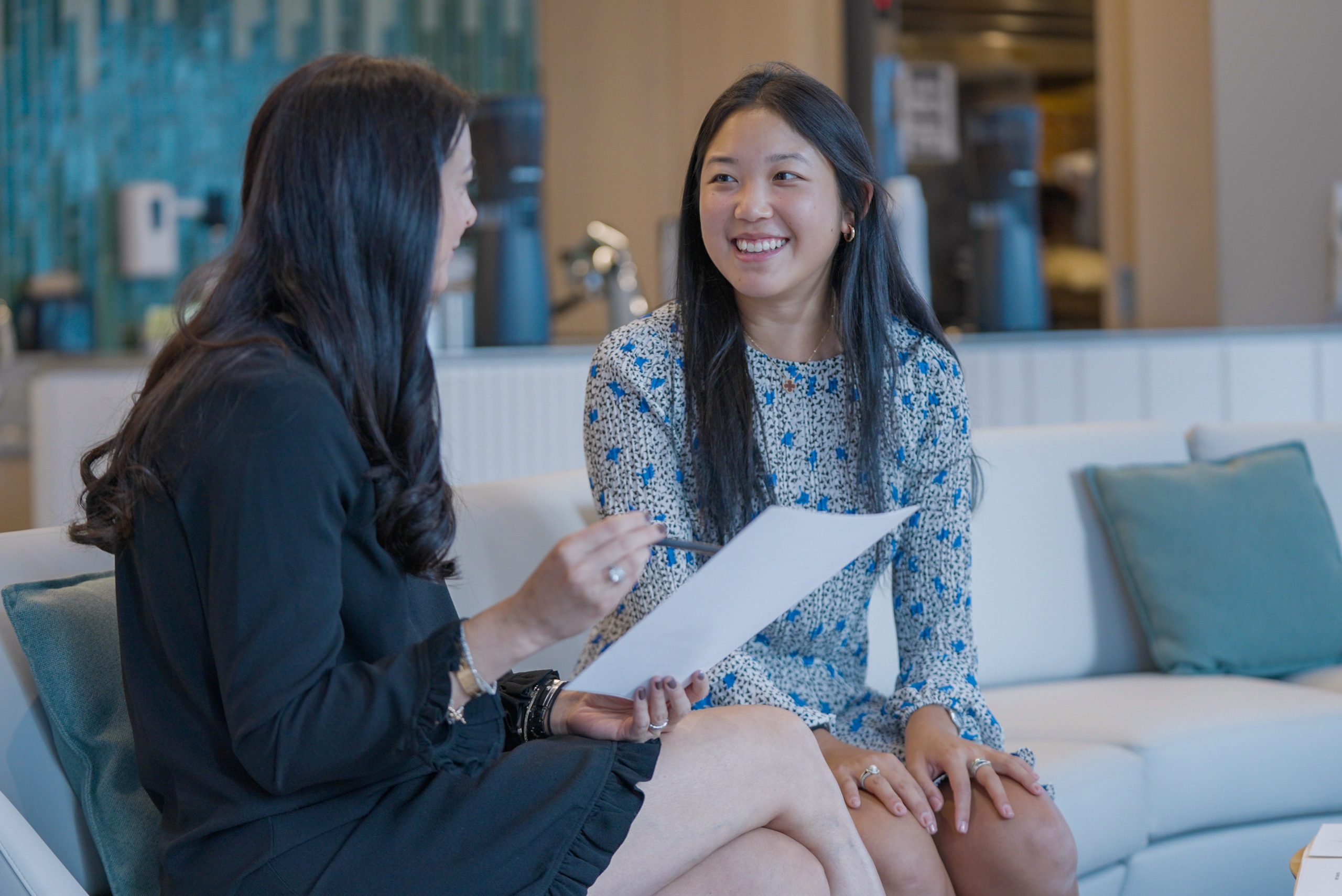 two women talking in office