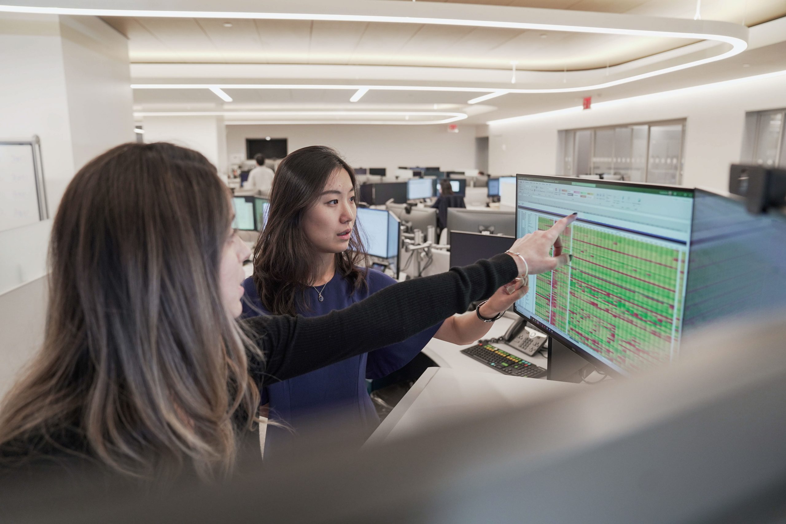 two people working at computer