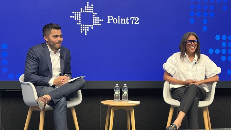 Man and woman speaking on panel