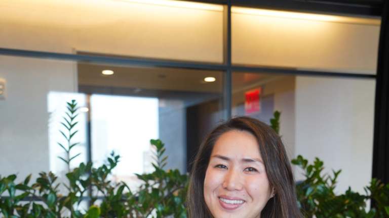 Woman sitting at conference table