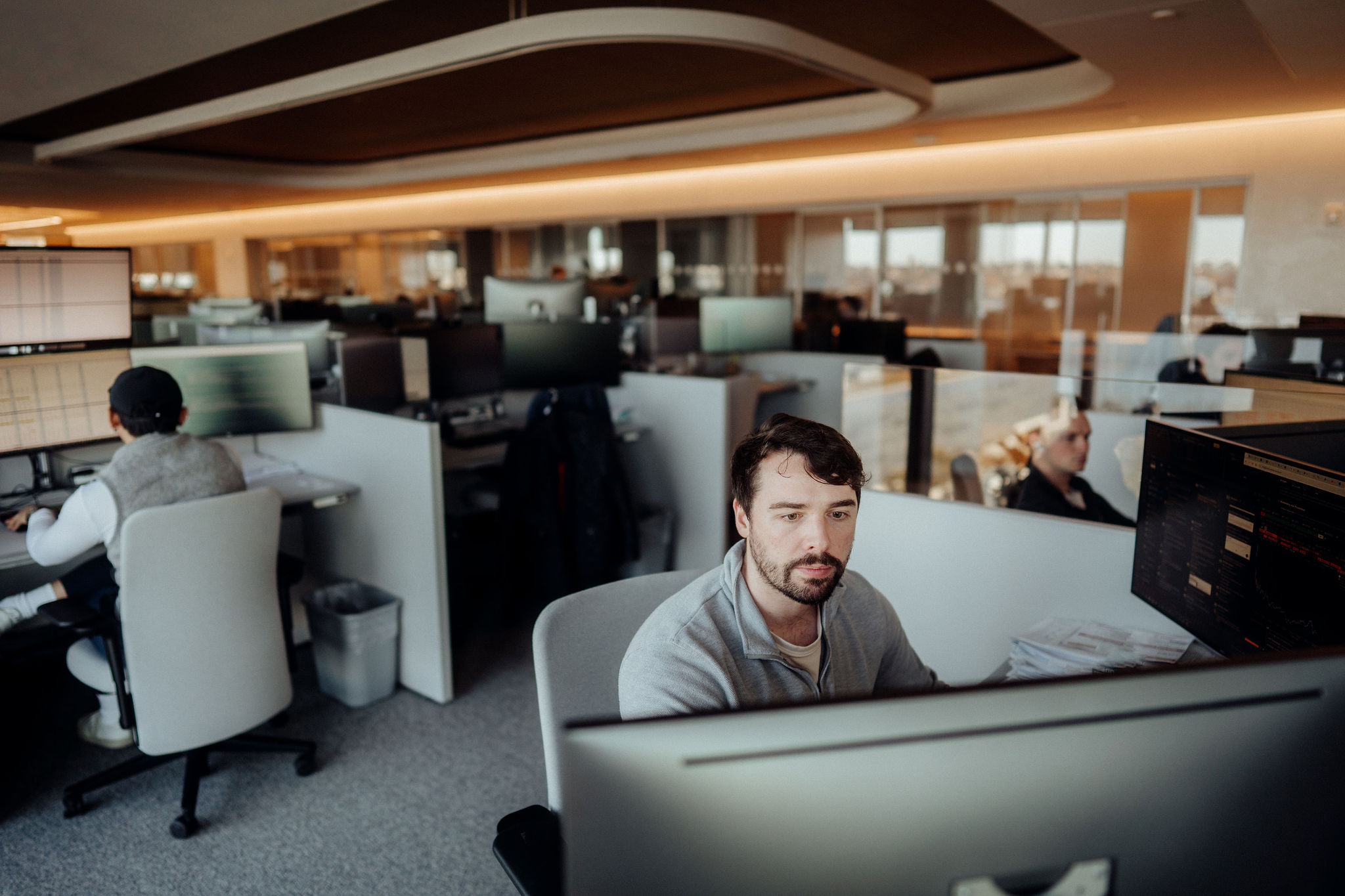 Photo of person at a desk in an office setting