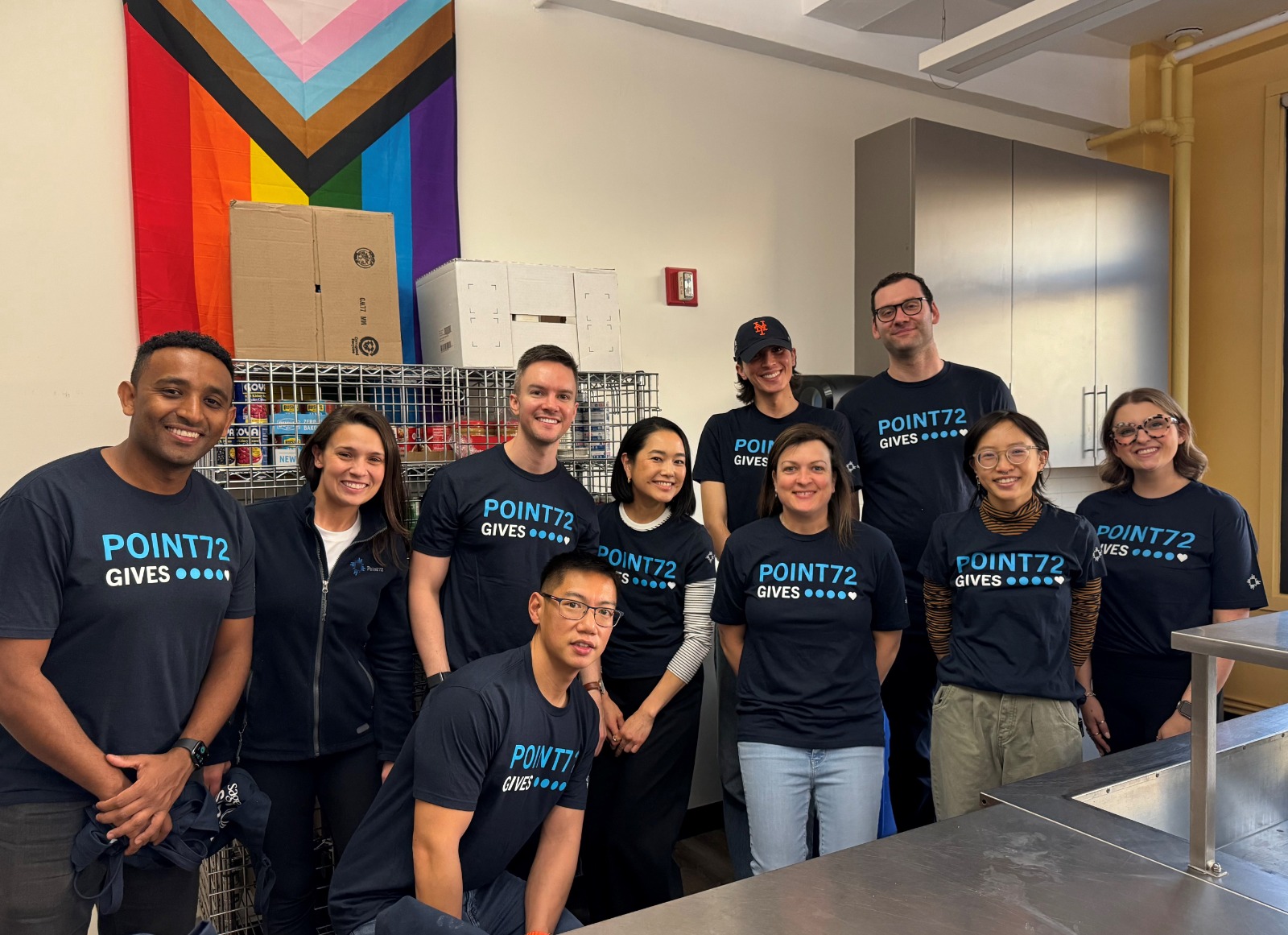 Photo of a group of employees at a volunteer event in a kitchen