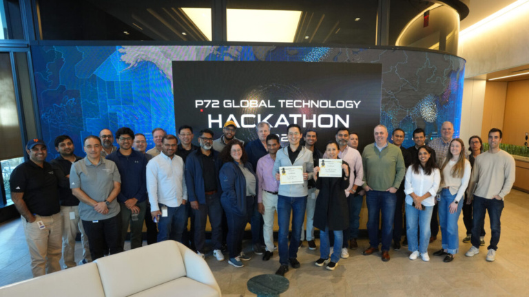 Photo of group of people at an office for a hackathon