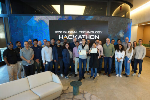 Photo of group of people at an office for a hackathon