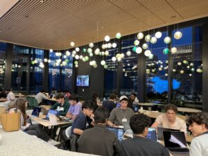 Students coding at hackathon