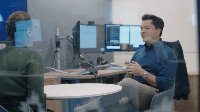 gabe sanders having discussion with colleague