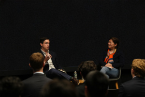 Point72 employees, Jean and Adam, hosting a fireside chat